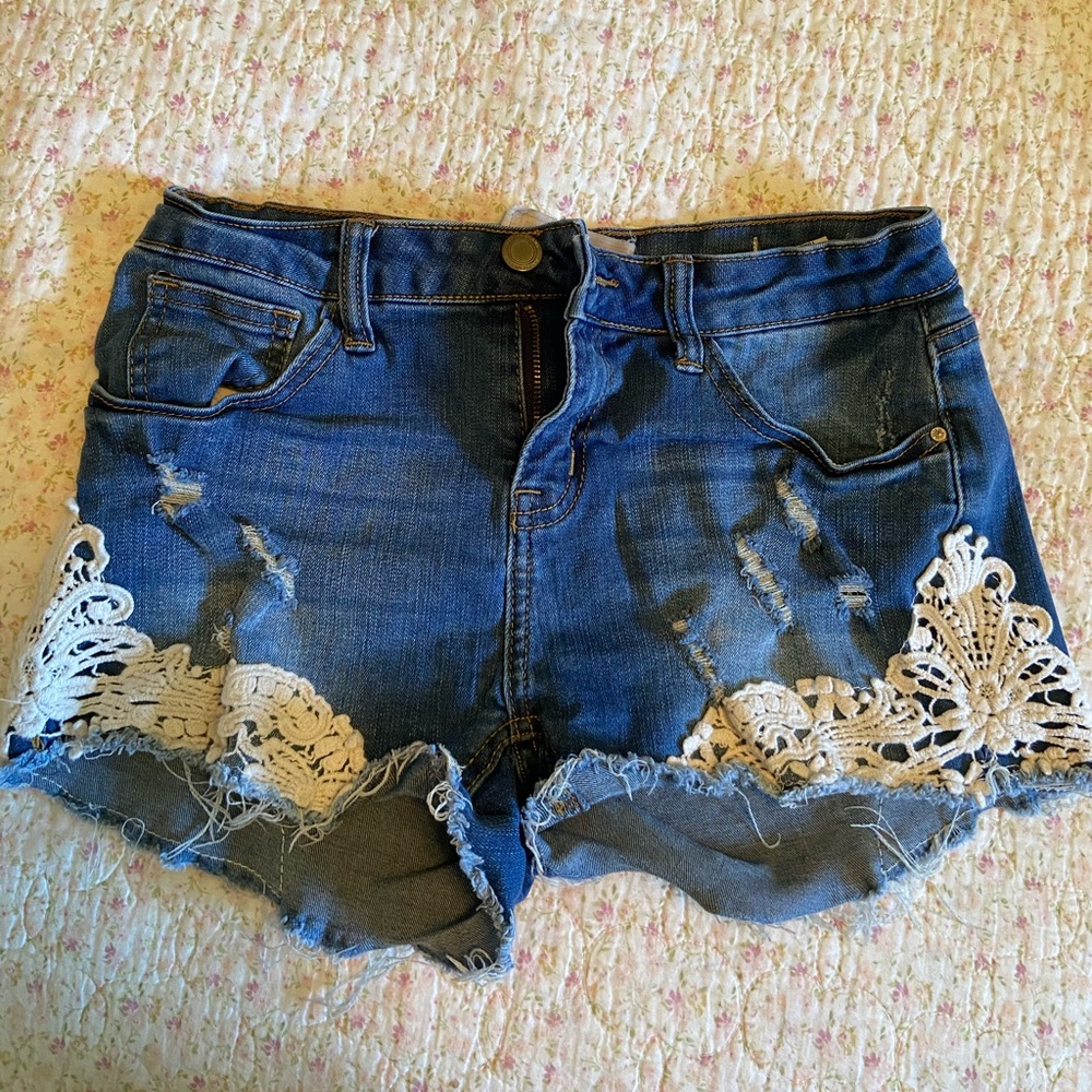 Lace mid-rise jean shorts